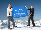 Yan Sevalnev and Alan Spelnikov with Monitor Electric's flag